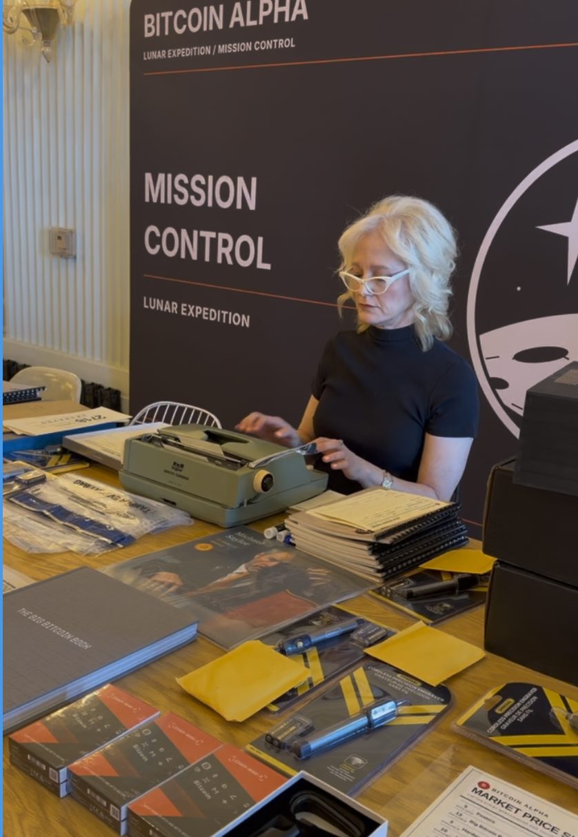 Typing up mission paperwork on the Smith Corona